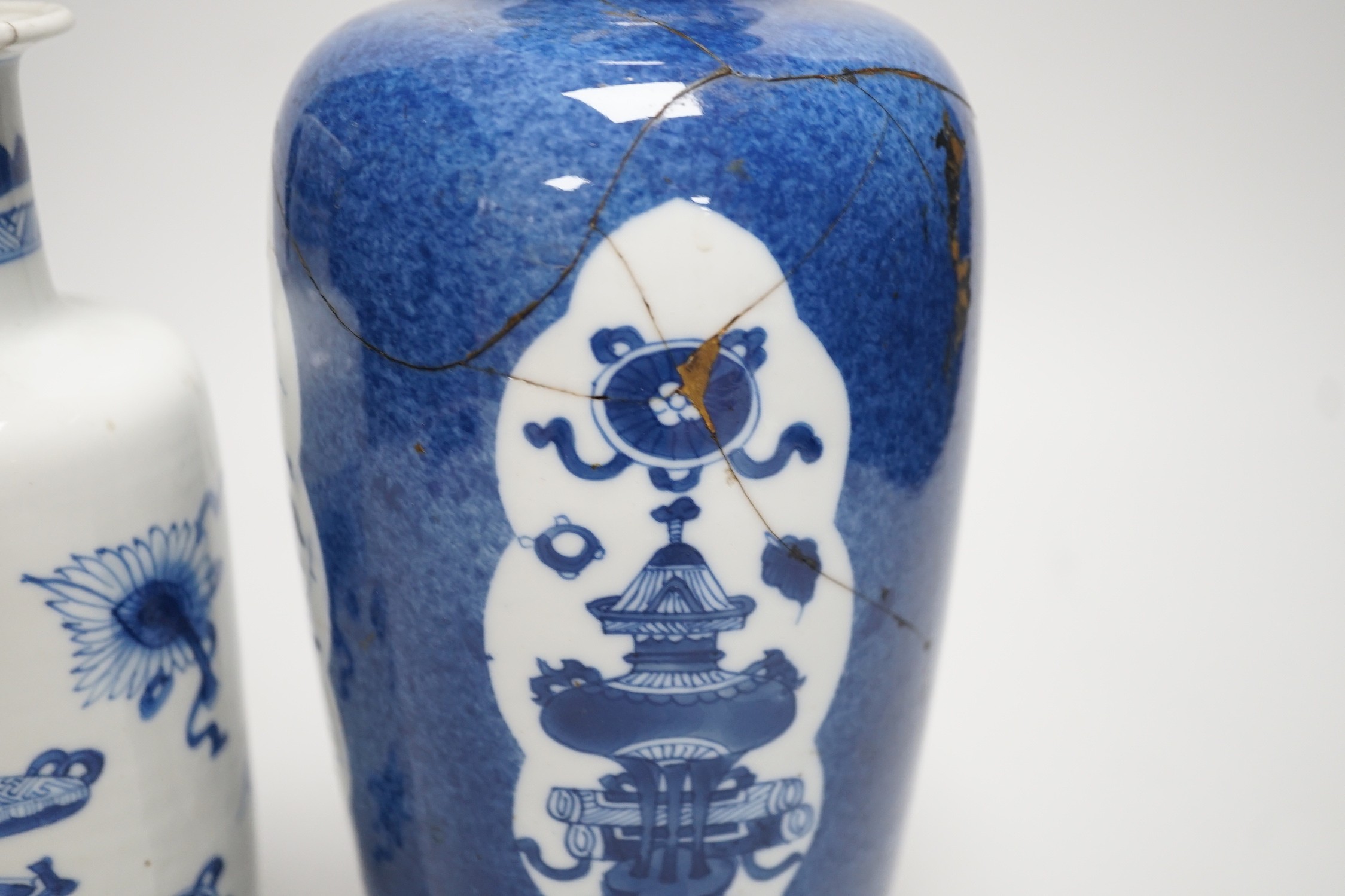 A Chinese blue and white ‘precious objects’ export vase, together with a Chinese powder blue export vase, open vignettes (a.f.) tallest 24.5cms